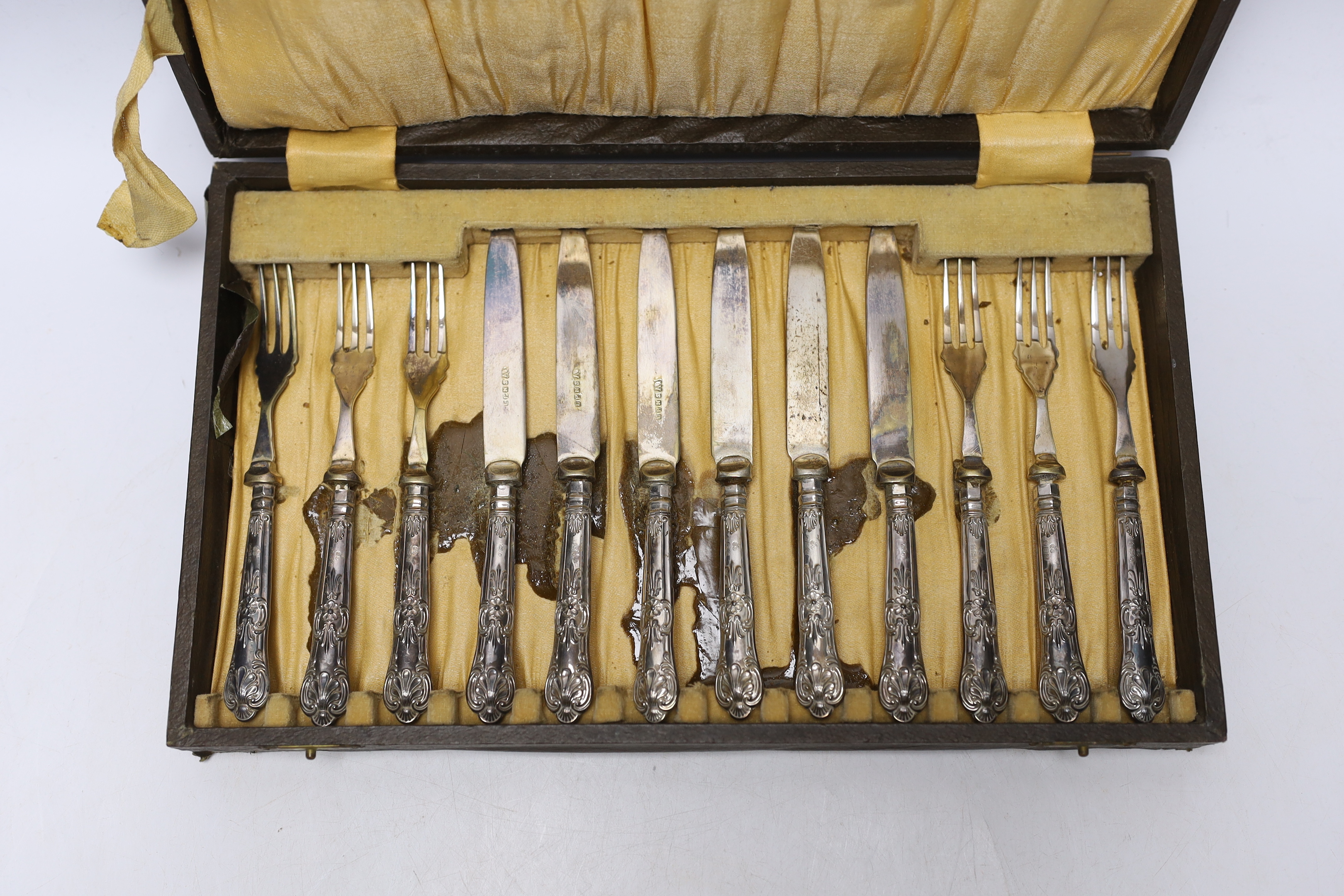 A cased set of six pairs of George V silver handled dessert eaters, C.H. Beatson, Sheffield, 1931.